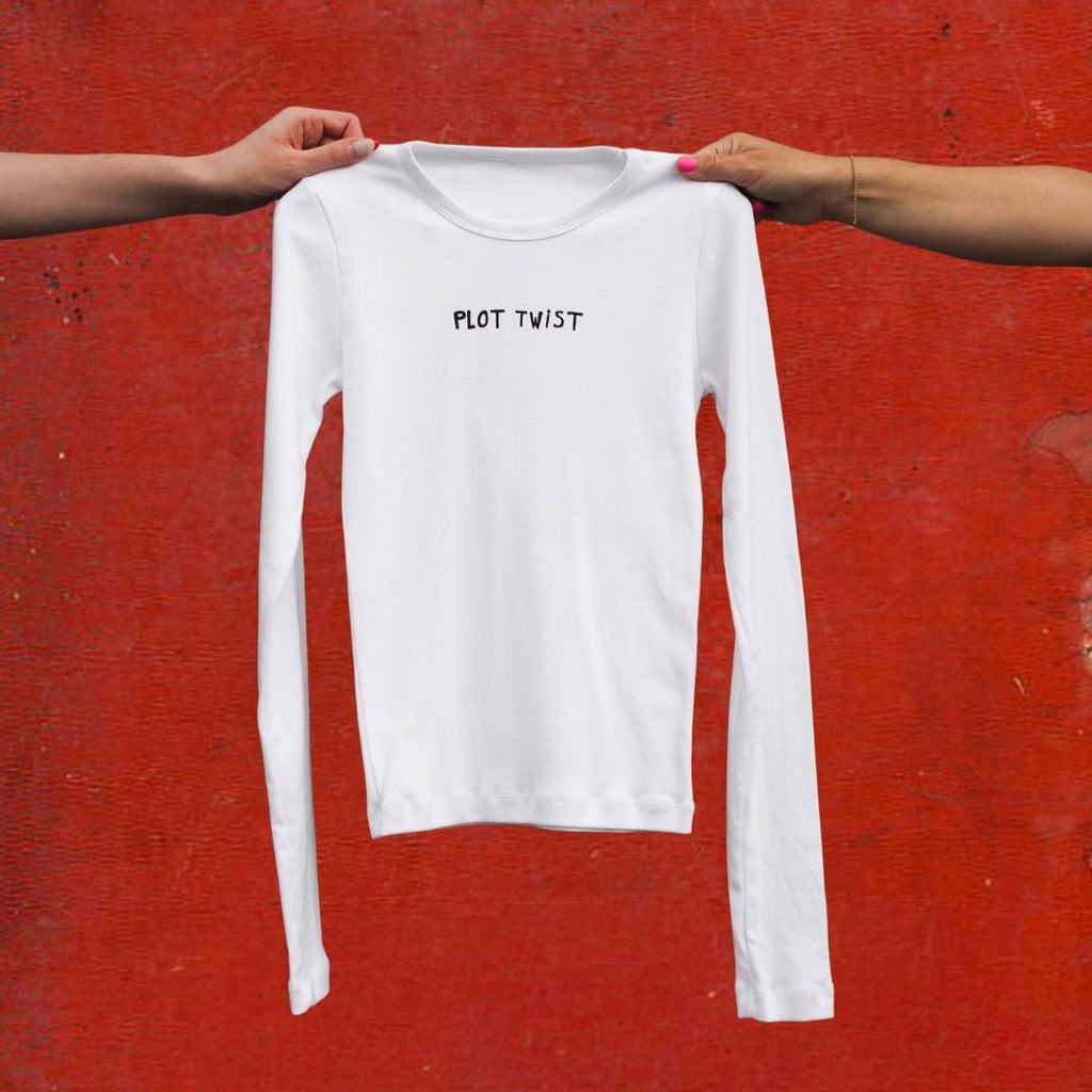 "Plot Twist" White Long Sleeve Baby Tee - Intrigue Ink Visit Bozeman, Unique Shopping Boutique in Montana, Work from Home Clothes for Women