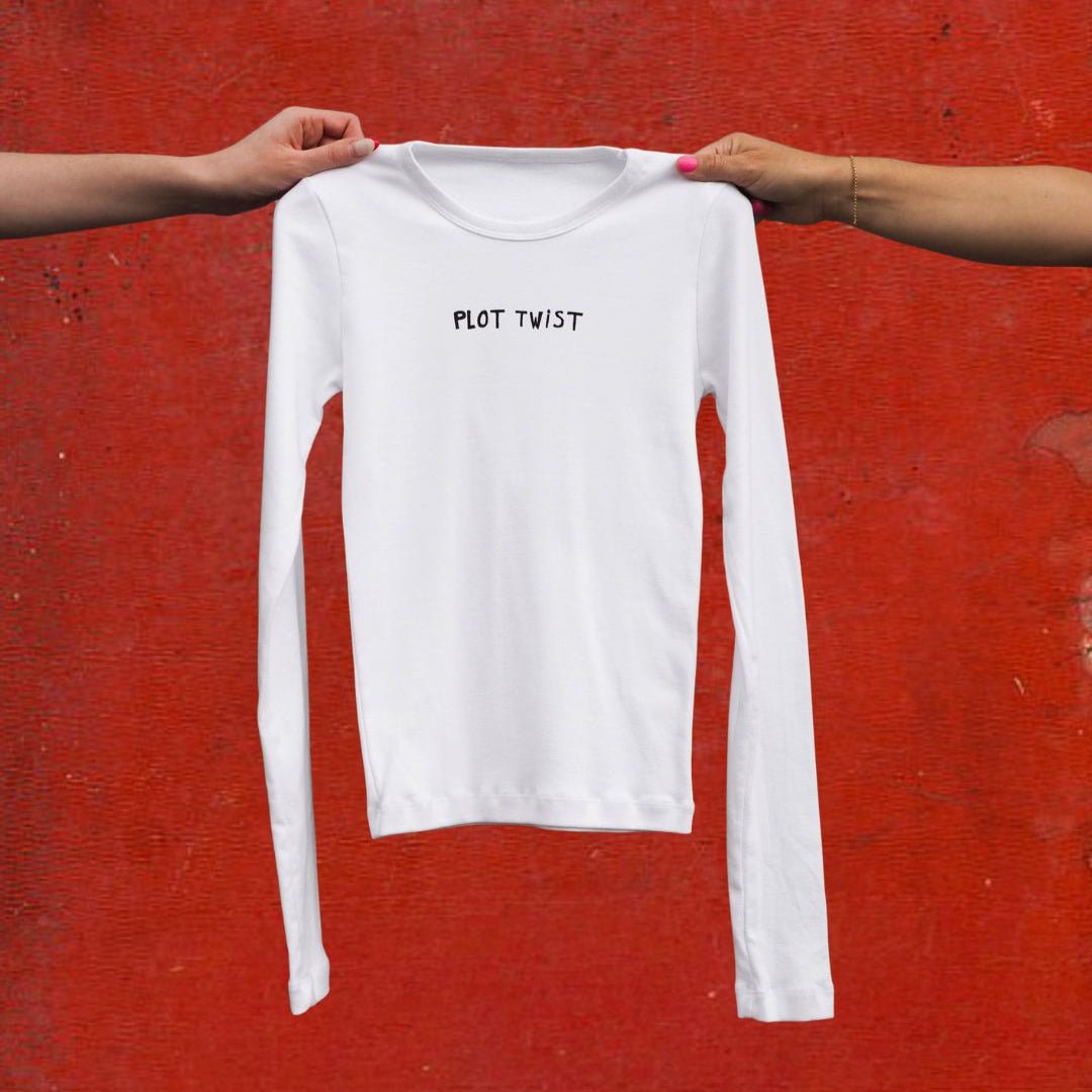 "Plot Twist" White Long Sleeve Baby Tee - Intrigue Ink Visit Bozeman, Unique Shopping Boutique in Montana, Work from Home Clothes for Women