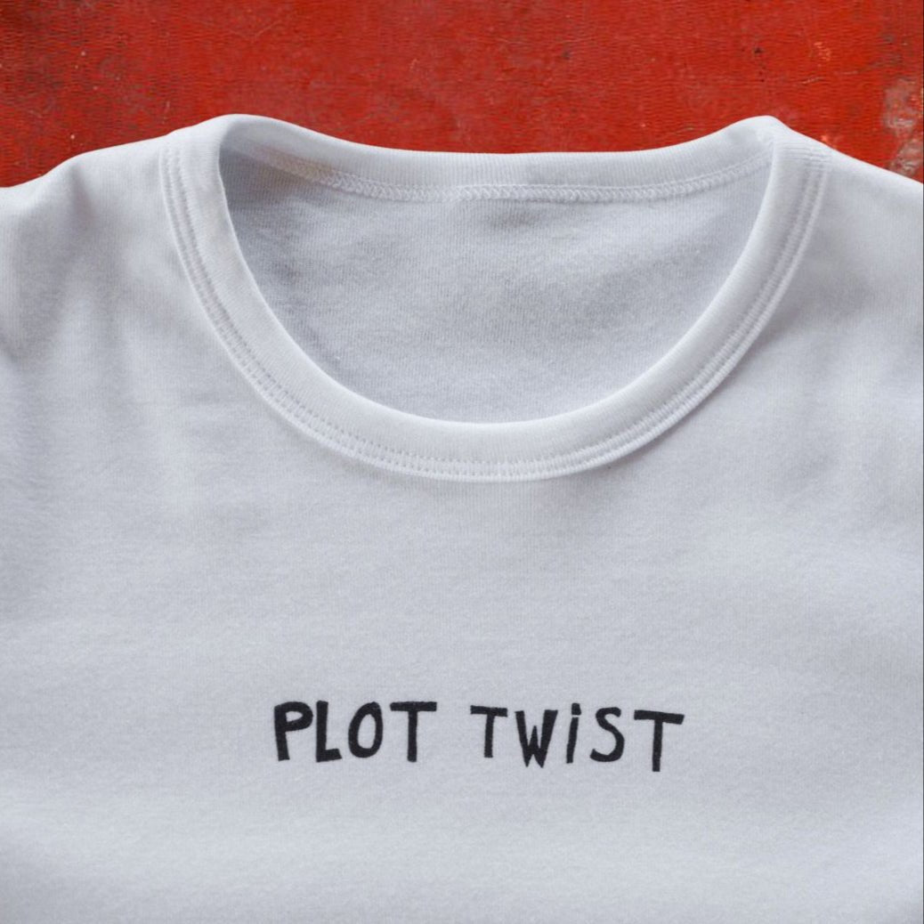 "Plot Twist" White Long Sleeve Baby Tee - Intrigue Ink Visit Bozeman, Unique Shopping Boutique in Montana, Work from Home Clothes for Women