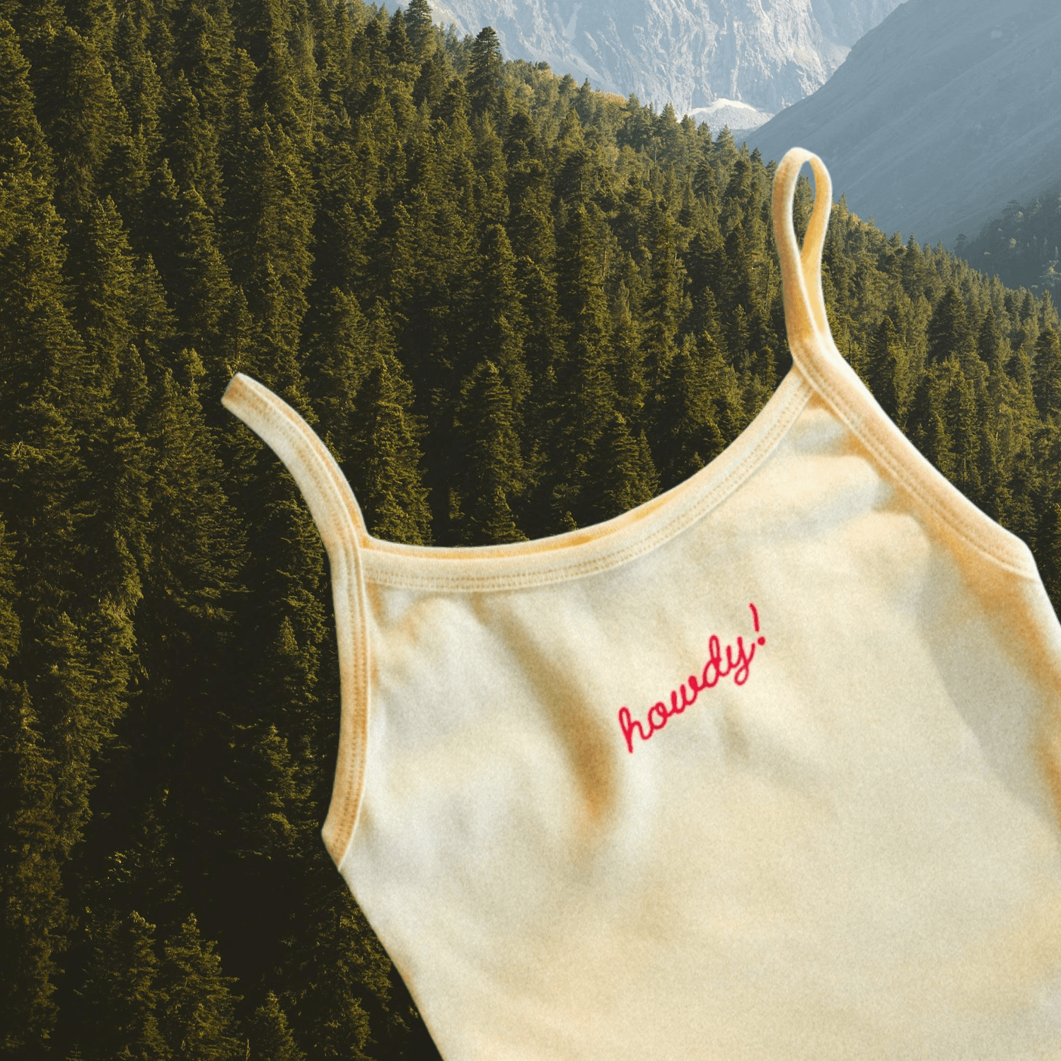 "Howdy!" Tank in Butter - Intrigue Ink Visit Bozeman, Unique Shopping Boutique in Montana, Work from Home Clothes for Women