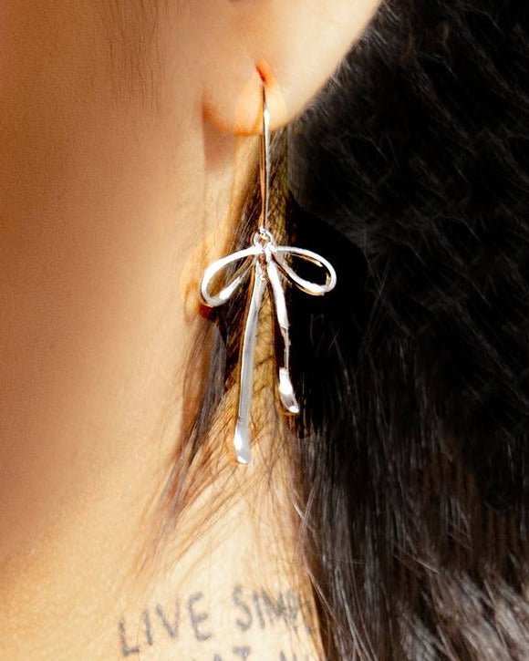Bad To the Bow Earrings - Silver Rhodium Plated - Intrigue Ink Visit Bozeman, Unique Shopping Boutique in Montana, Work from Home Clothes for Women