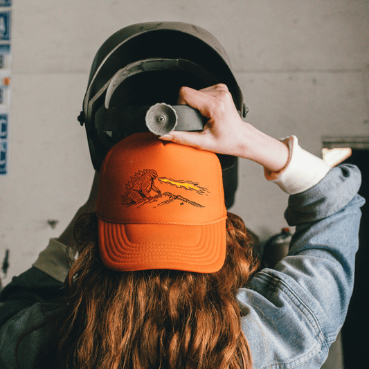 "Monster in the Mountains" Orange Trucker - Intrigue Ink Visit Bozeman, Unique Shopping Boutique in Montana, Work from Home Clothes for Women