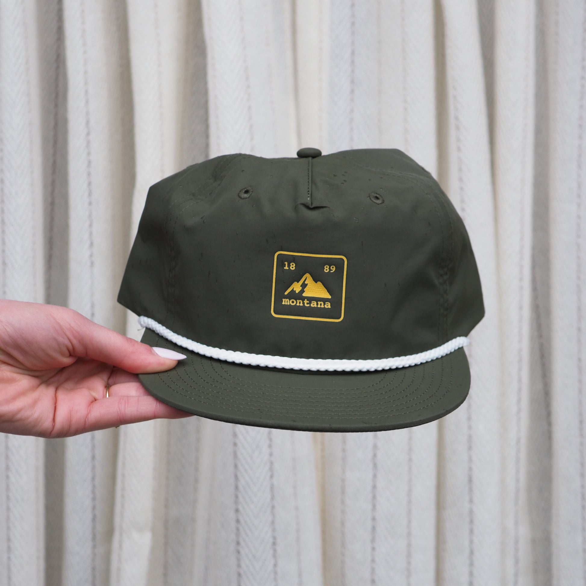 "Montana State Badge" Hat in Green - Intrigue Ink Visit Bozeman, Unique Shopping Boutique in Montana, Work from Home Clothes for Women
