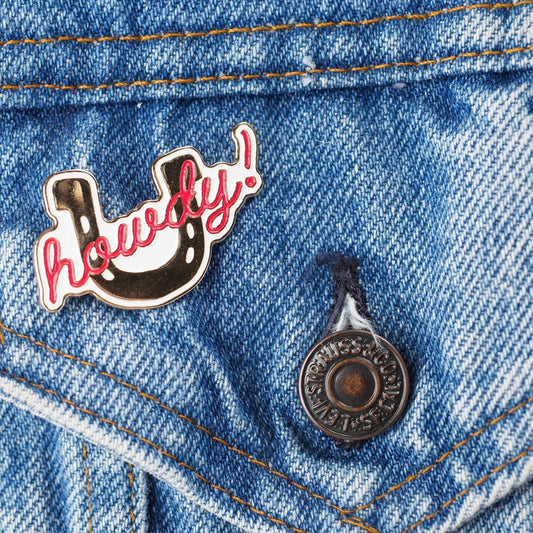 "Howdy!" Pin - Intrigue Ink Visit Bozeman, Unique Shopping Boutique in Montana, Work from Home Clothes for Women